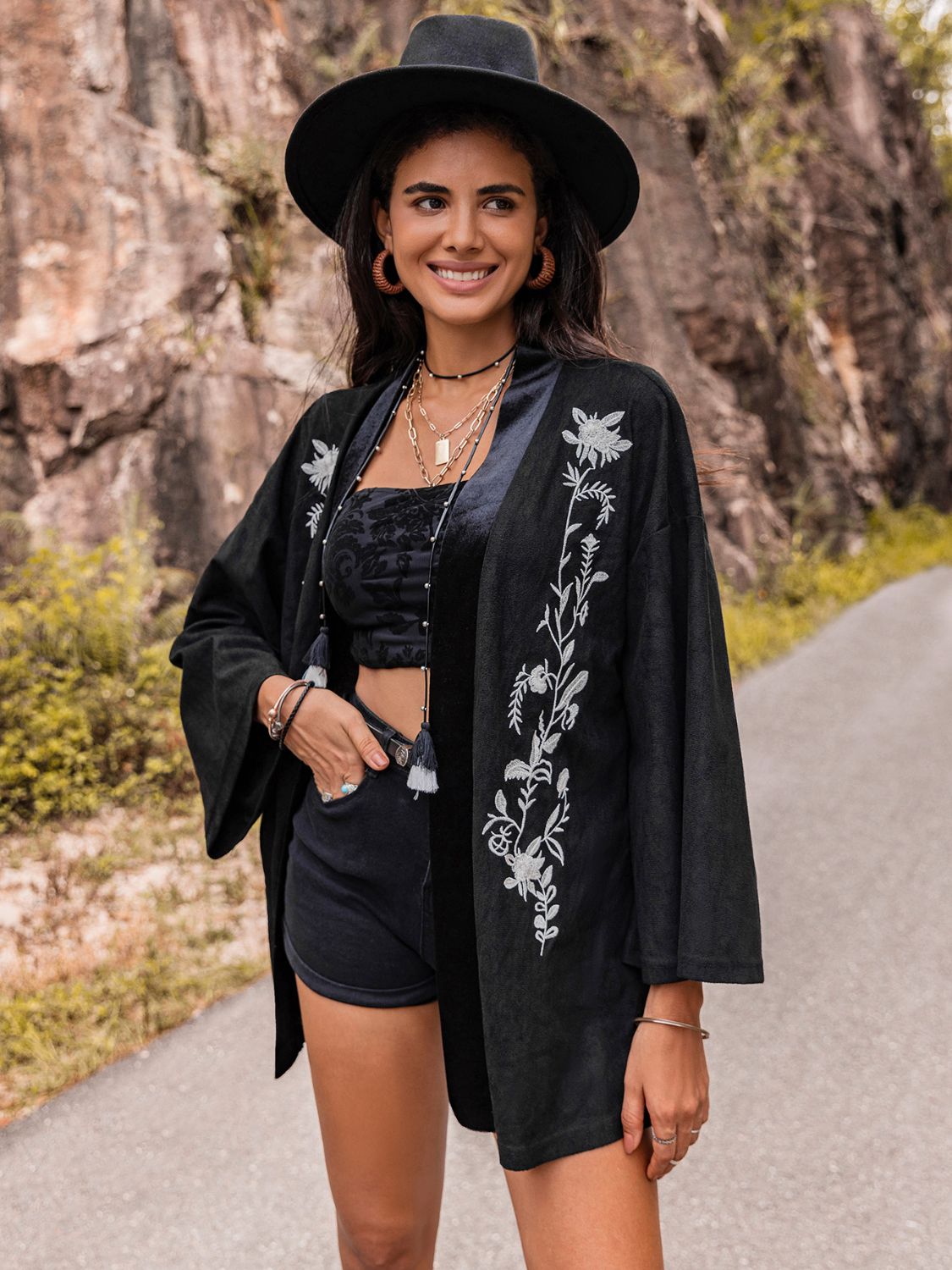 Women’s bohemian-style black kimono cardigan with embroidery.
