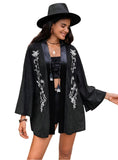 Boho embroidered black kimono cardigan with floral design, front view.
