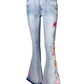 Boho-inspired floral embroidered denim jeans with flared leg.
