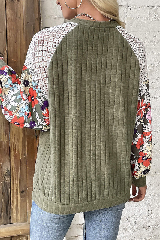 Lightweight olive top with vibrant floral sleeves, perfect for fall