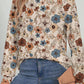 Boho floral print top in warm tones, ideal for casual or dressy occasions.
