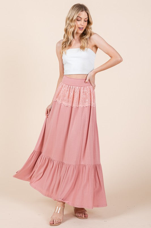 Women's casual tiered maxi skirt with lace waistband detail.
