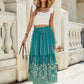 Full view of green boho skirt with maxi length and elegant details.