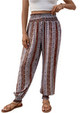 Women's boho striped pants with a floral print and smocked waistband.