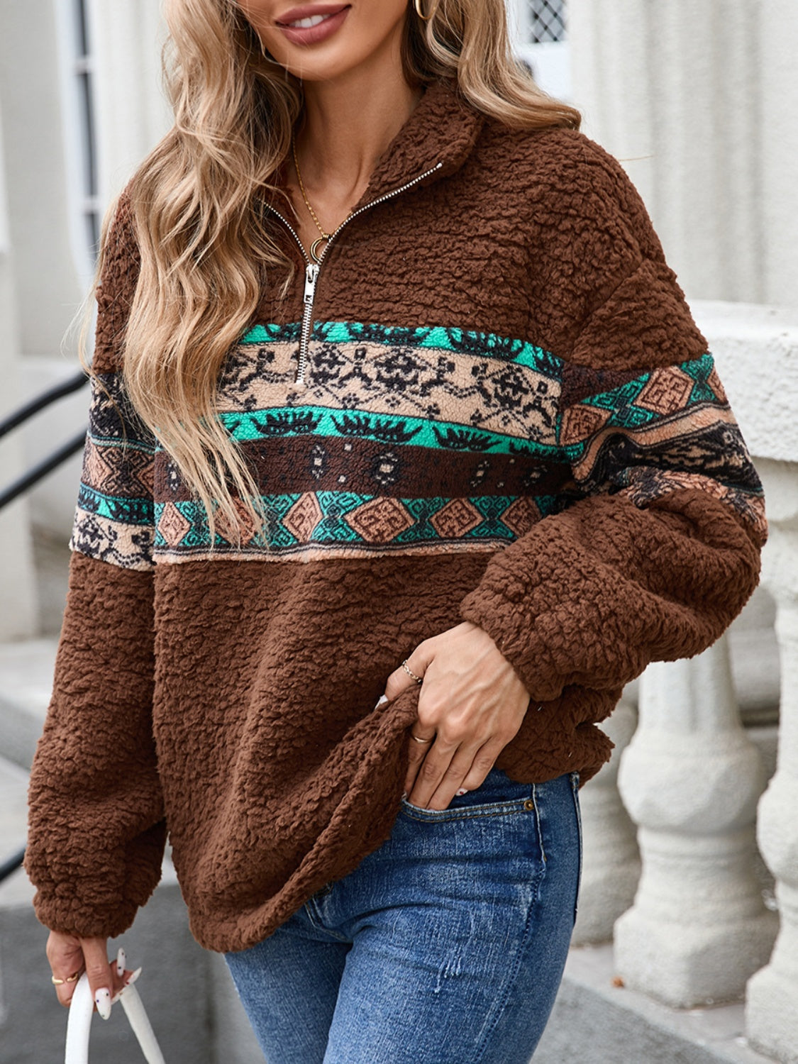 Warm brown sweatshirt with half-zip and Aztec print, great for layering.
