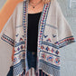 Open-front fringe cardigan featuring tribal-inspired patterns
