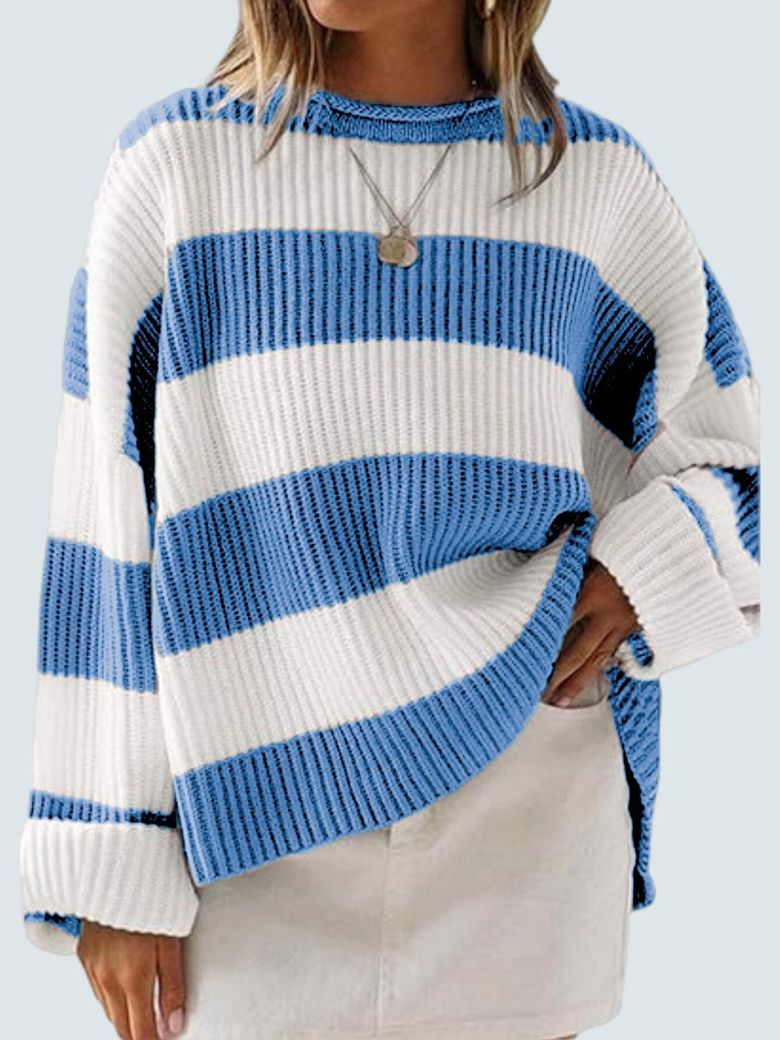 Soft blue sweater with ribbed texture and bold white stripes.
