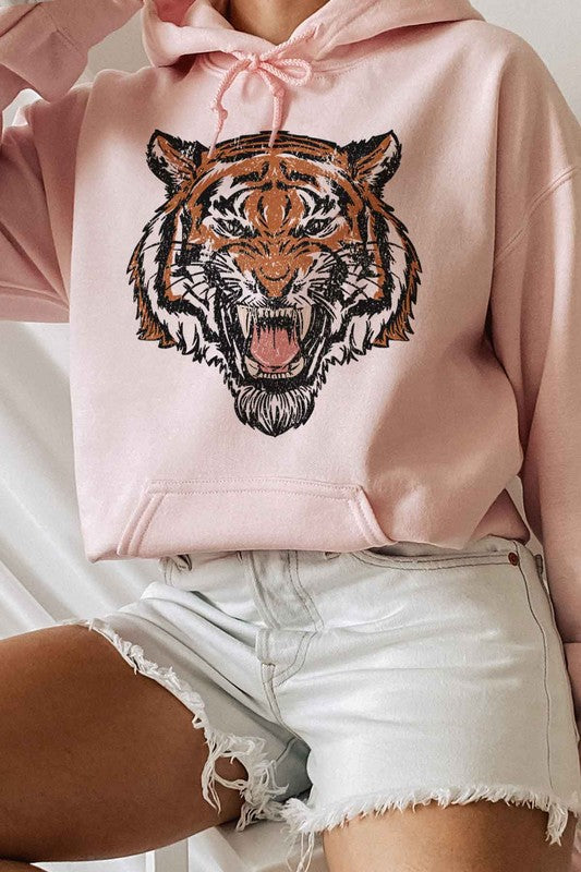 Bold pink tiger hoodie styled for a casual day out
