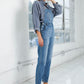 Casual pocketed denim jumpsuit styled for everyday wear.
