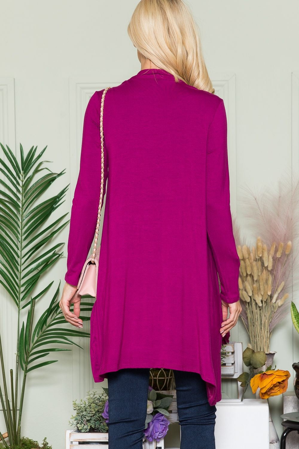 Longline cardigan in a vibrant color layered over a casual outfit