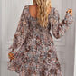 Brown square-neck dress with a feminine silhouette and bold bohemian floral print.
