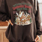 Warm brown sweatshirt with North Pole Gingerbread Bakery graphic for a cozy look.