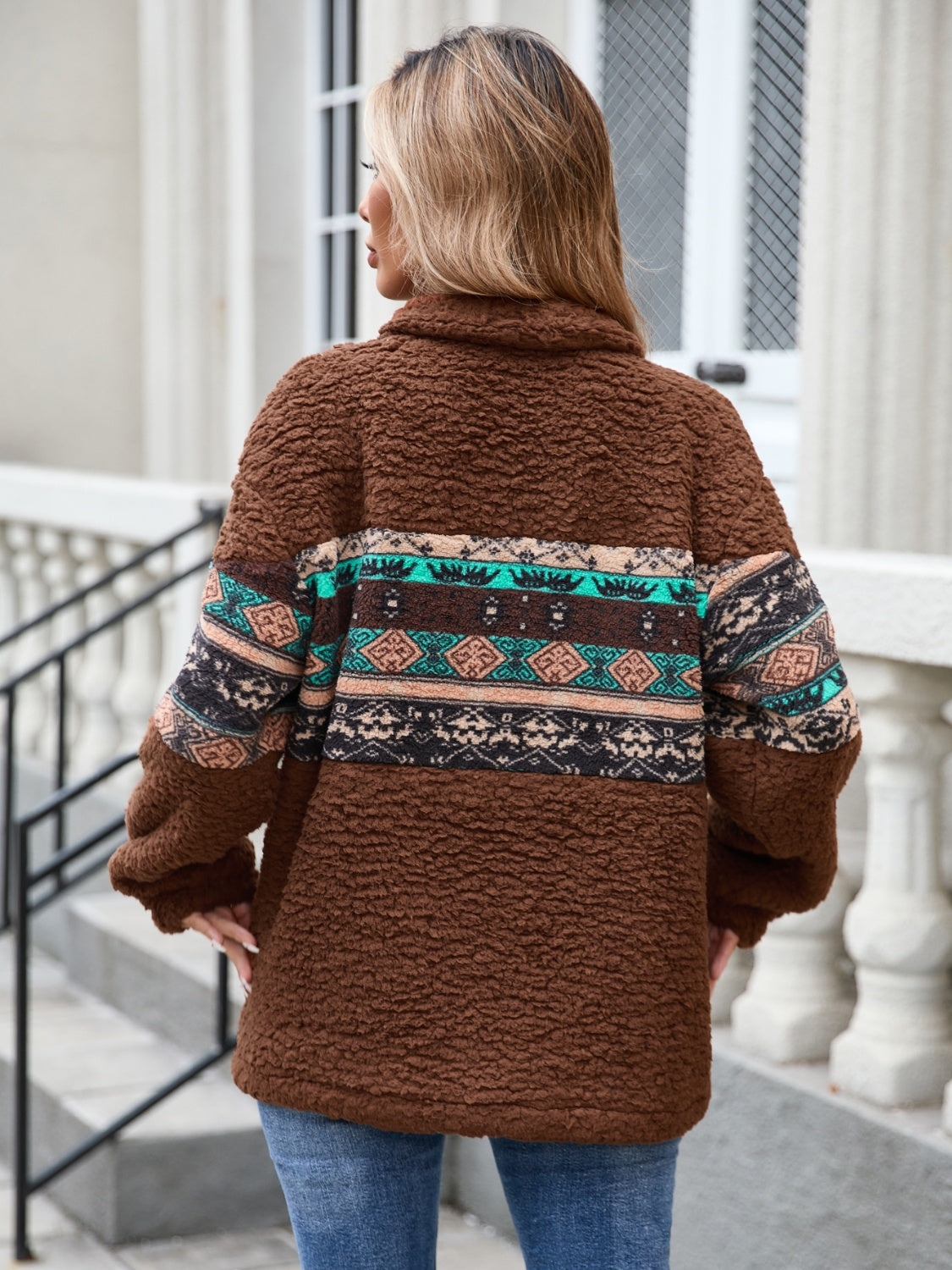 Soft sherpa fleece sweatshirt in brown with a vibrant Aztec pattern across the chest.
