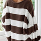 Brown striped pullover with ribbed texture, adding warmth and style.
