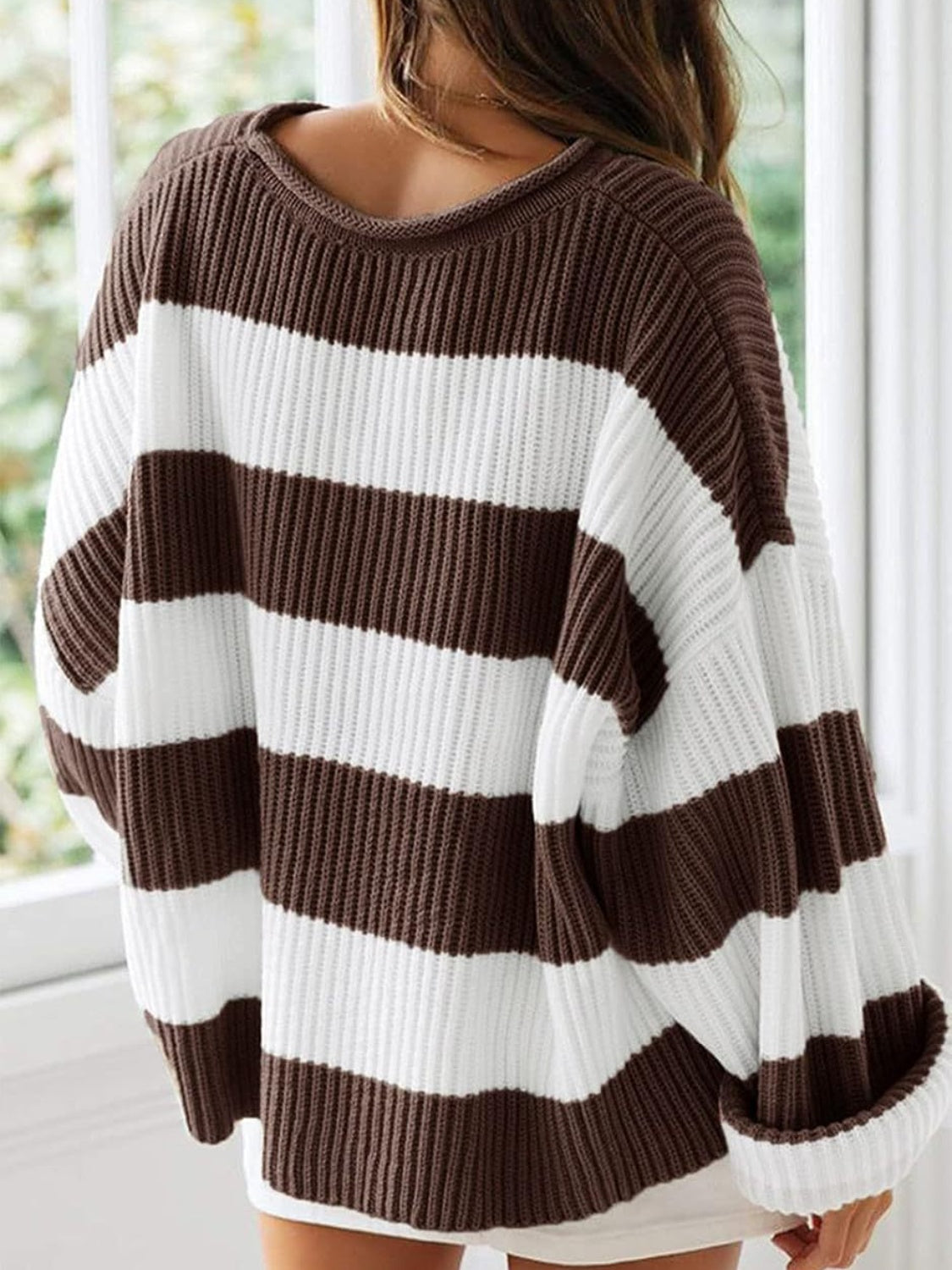 Brown striped pullover with ribbed texture, adding warmth and style.
