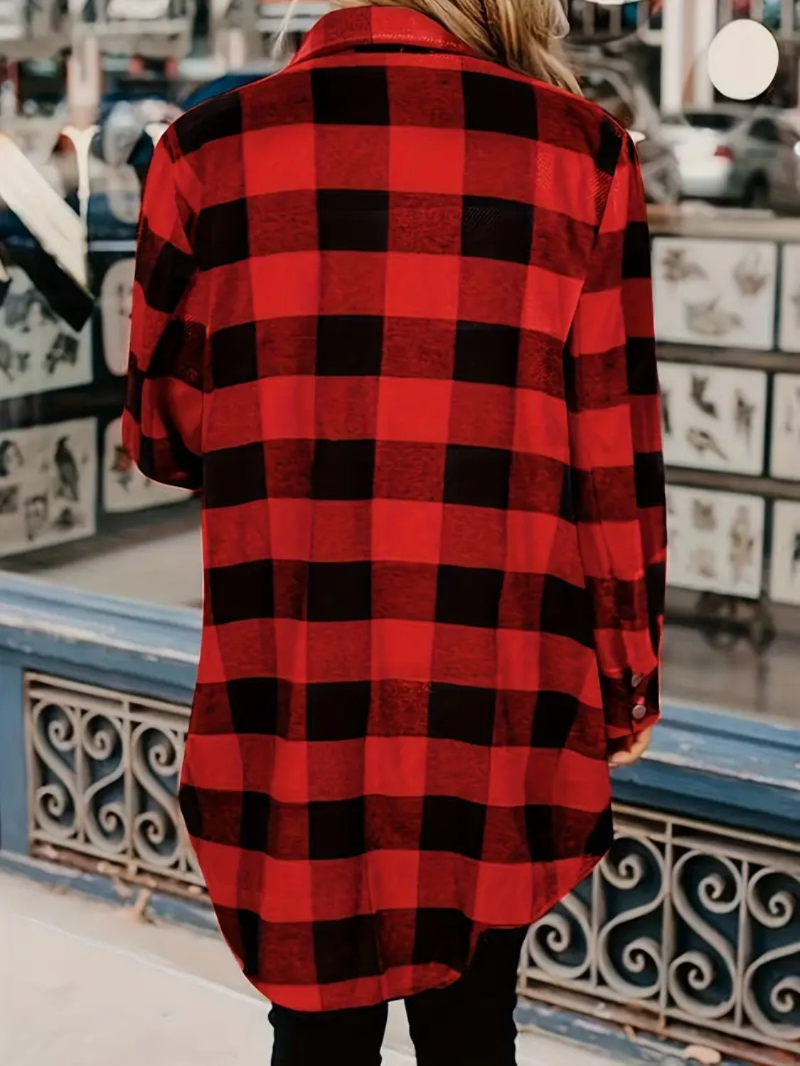 Buffalo plaid flannel shacket with pockets and button closure.
