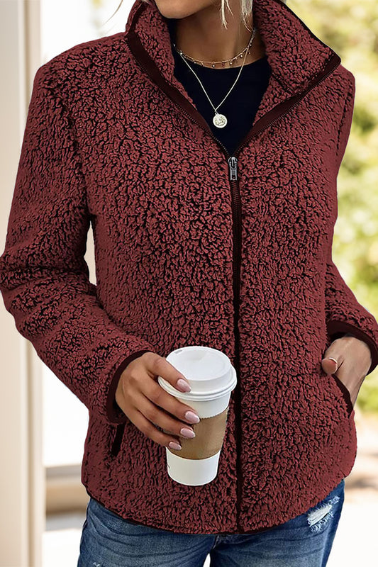 Burgundy women's fleece sherpa jacket, offering warmth and comfort for casual outings.
