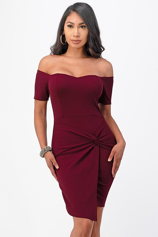 Front view of the burgundy off-shoulder bodycon dress with a twist-front waist.