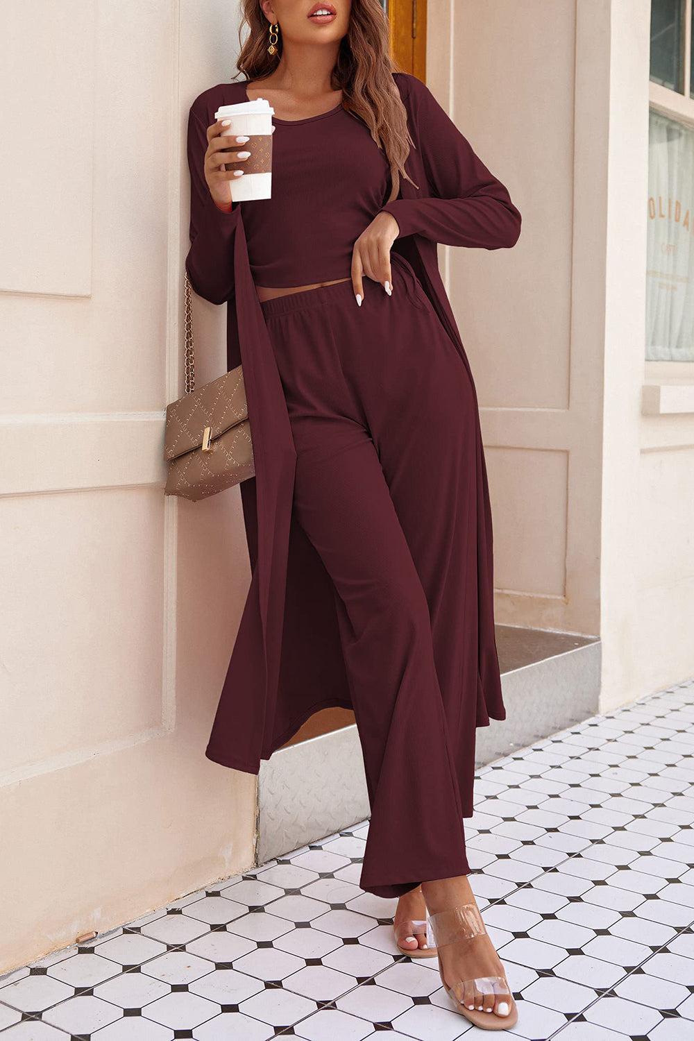 Elegant burgundy pant suit set with a sleeveless top and matching wide-leg pants
