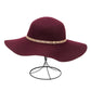 Front view of a burgundy wool felt floppy hat with a decorative band.
