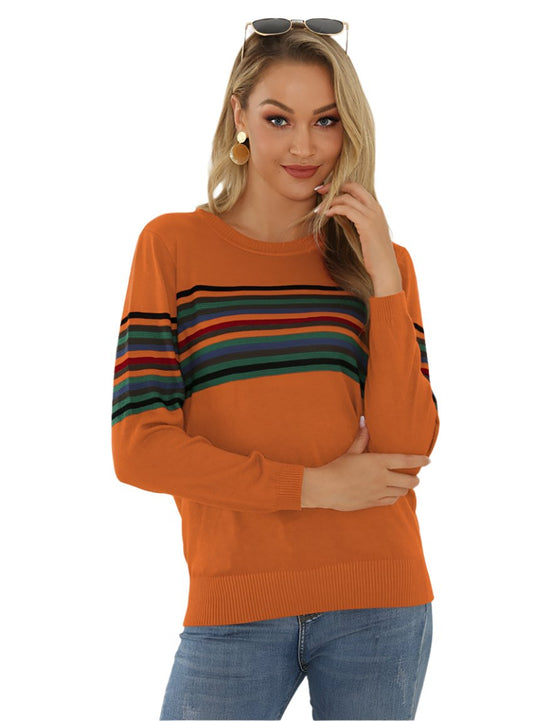 Close-up of a woman in a burnt orange striped knit sweater, perfect for fall layering
