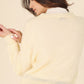 Back view of butter yellow wool blended sheer cardigan with relaxed fit