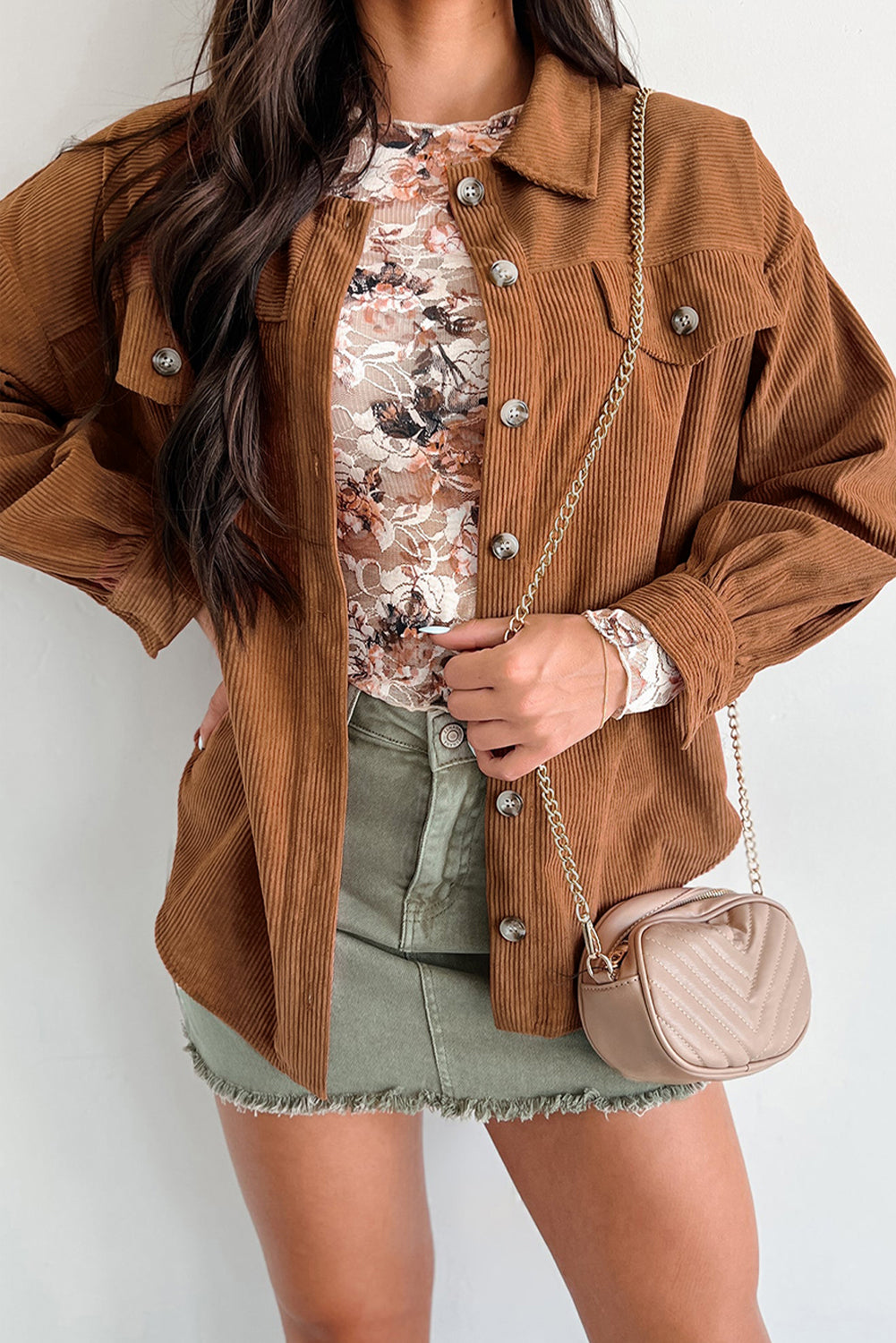 Trendy mocha corduroy shacket with a flattering fit and modern hem.
