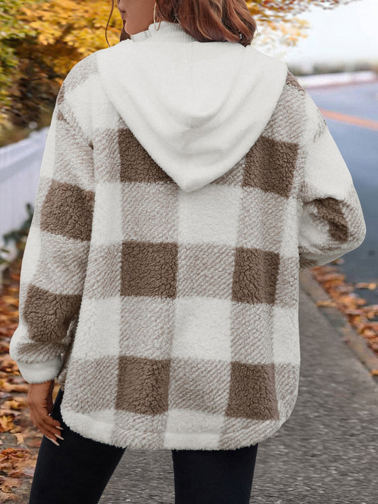 Neutral-colored hooded sherpa jacket in soft fleece fabric, perfect for cooler weather.
