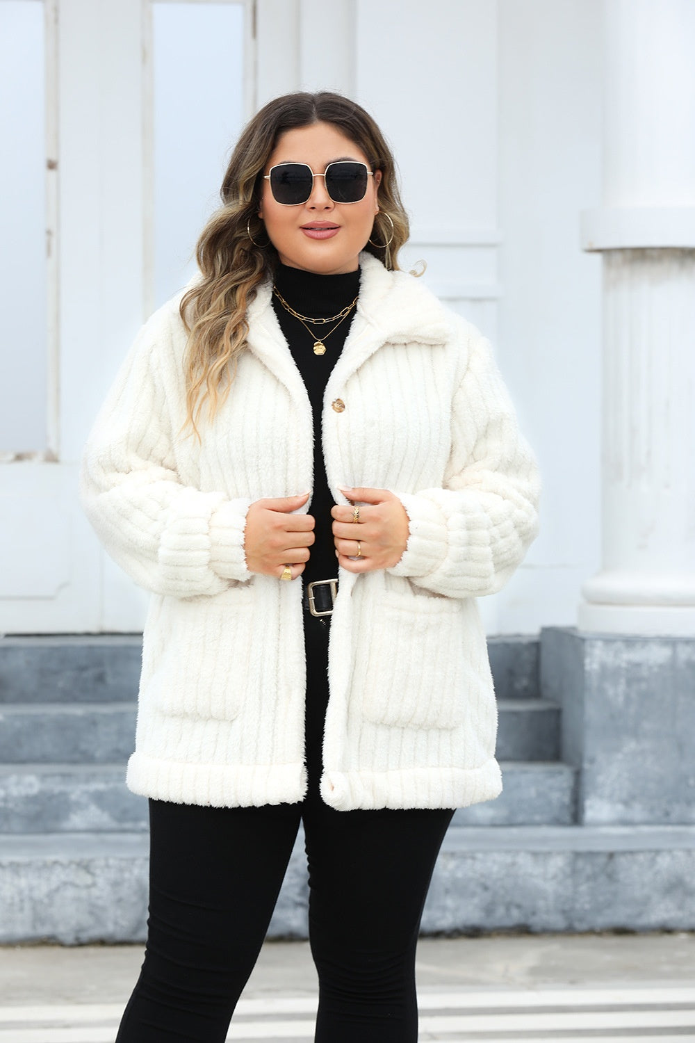 Women's plus size sherpa jacket featuring a button-up front.
