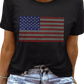 Sparkle in this Black Rhinestone American Flag Tee! Perfect blend of patriotism and style for any casual or celebratory occasion.