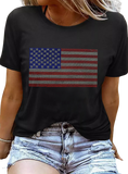 Sparkle in this Black Rhinestone American Flag Tee! Perfect blend of patriotism and style for any casual or celebratory occasion.