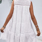 Chic Eyelet Mini Dress with a flattering tie-neck design, perfect for summer days and nights. Stay cool and stylish!