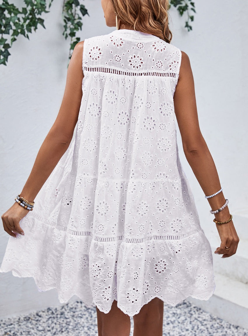 Chic Eyelet Mini Dress with a flattering tie-neck design, perfect for summer days and nights. Stay cool and stylish!