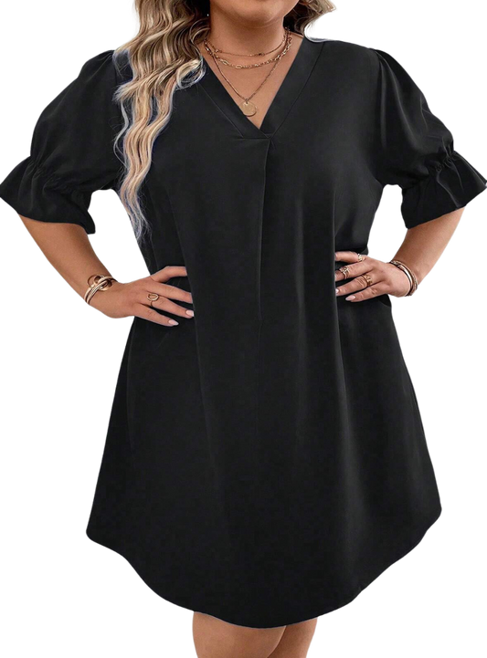 Elevate your style with our Plus Size Mini Dress featuring a chic V-neck and ruffled puff sleeves for a flattering, fashionable look.