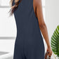 Chic waffle-knit romper with a flattering scoop neck, wide straps, and pockets for stylish comfort and versatility.