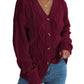 Burgundy cable knit button-up cardigan sweater with tortoiseshell buttons.
