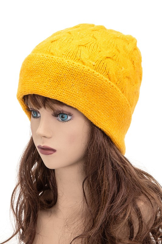 Slouchy mustard winter beanie with textured cable design

