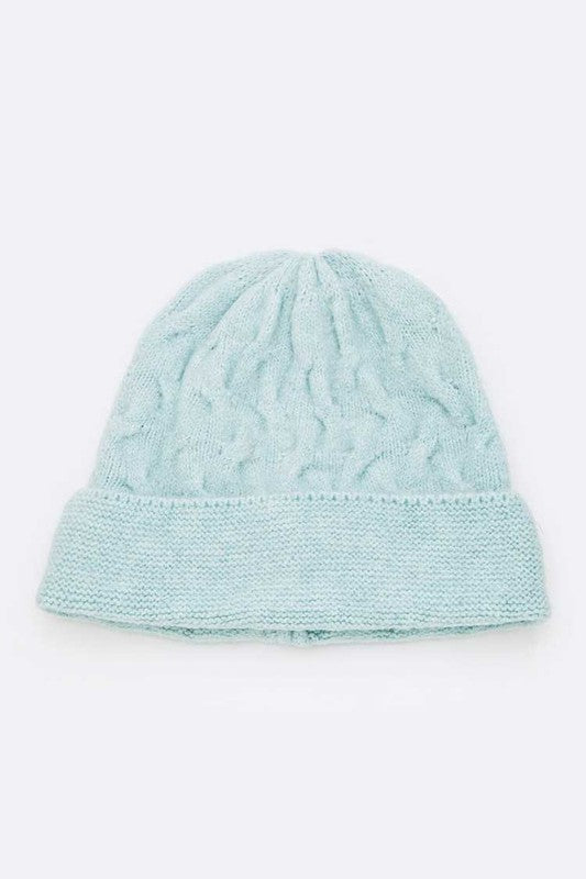 Slouchy turquoise winter beanie with textured cable design

