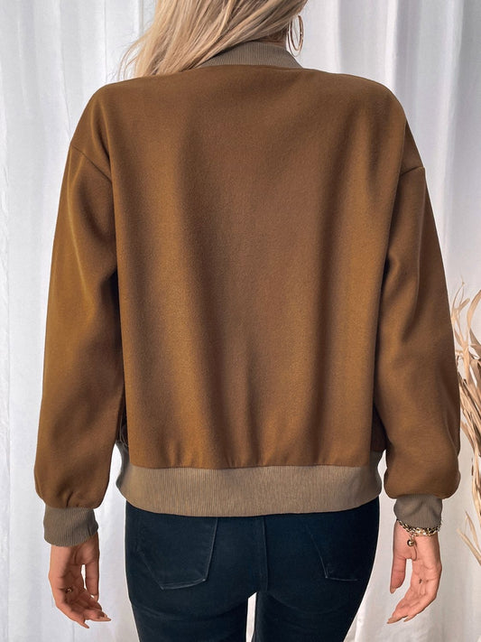 caramel jacket featuring pockets and snap closure
