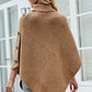 Stylish caramel turtleneck poncho perfect for layering.
