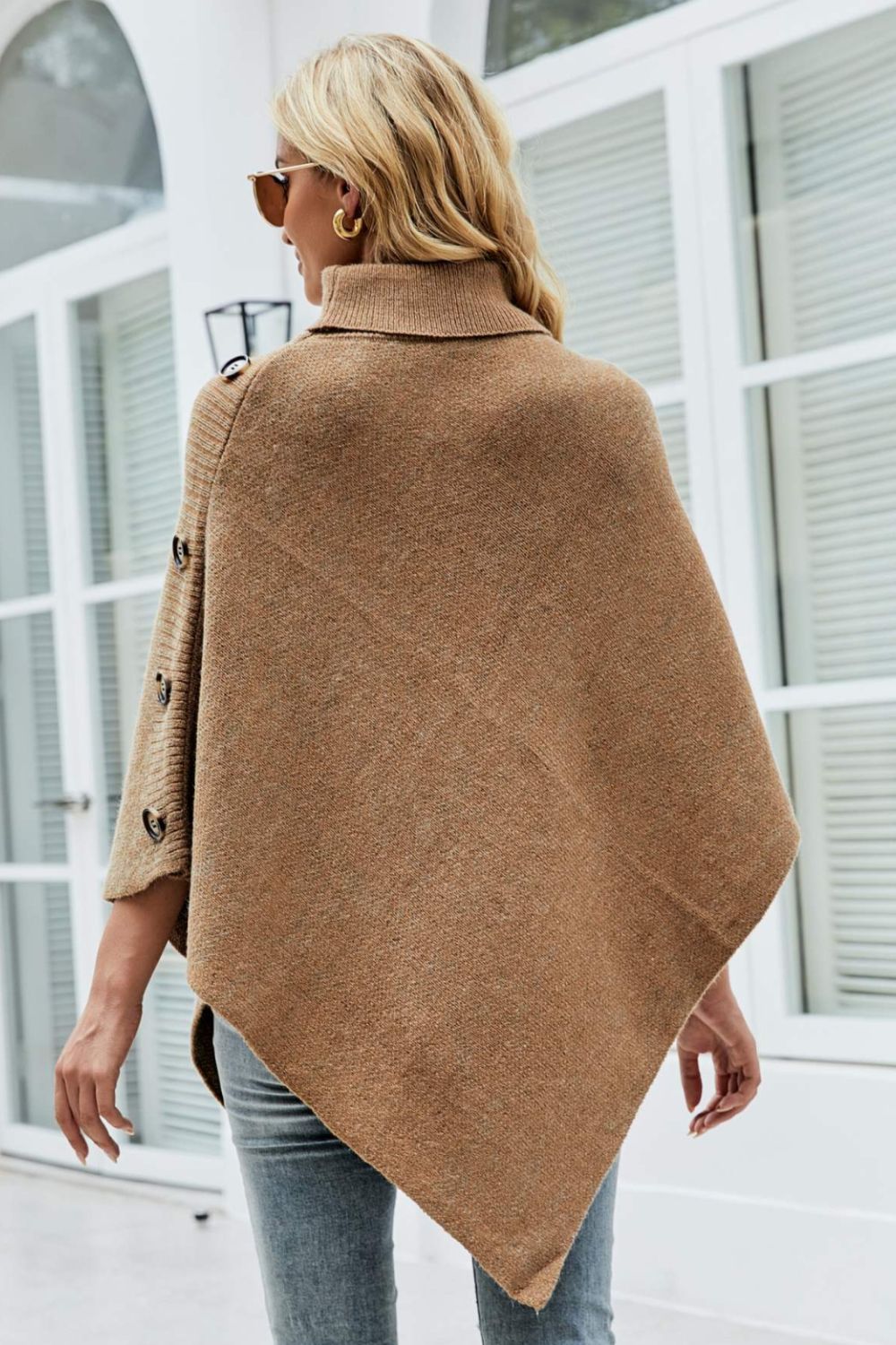 Stylish caramel turtleneck poncho perfect for layering.
