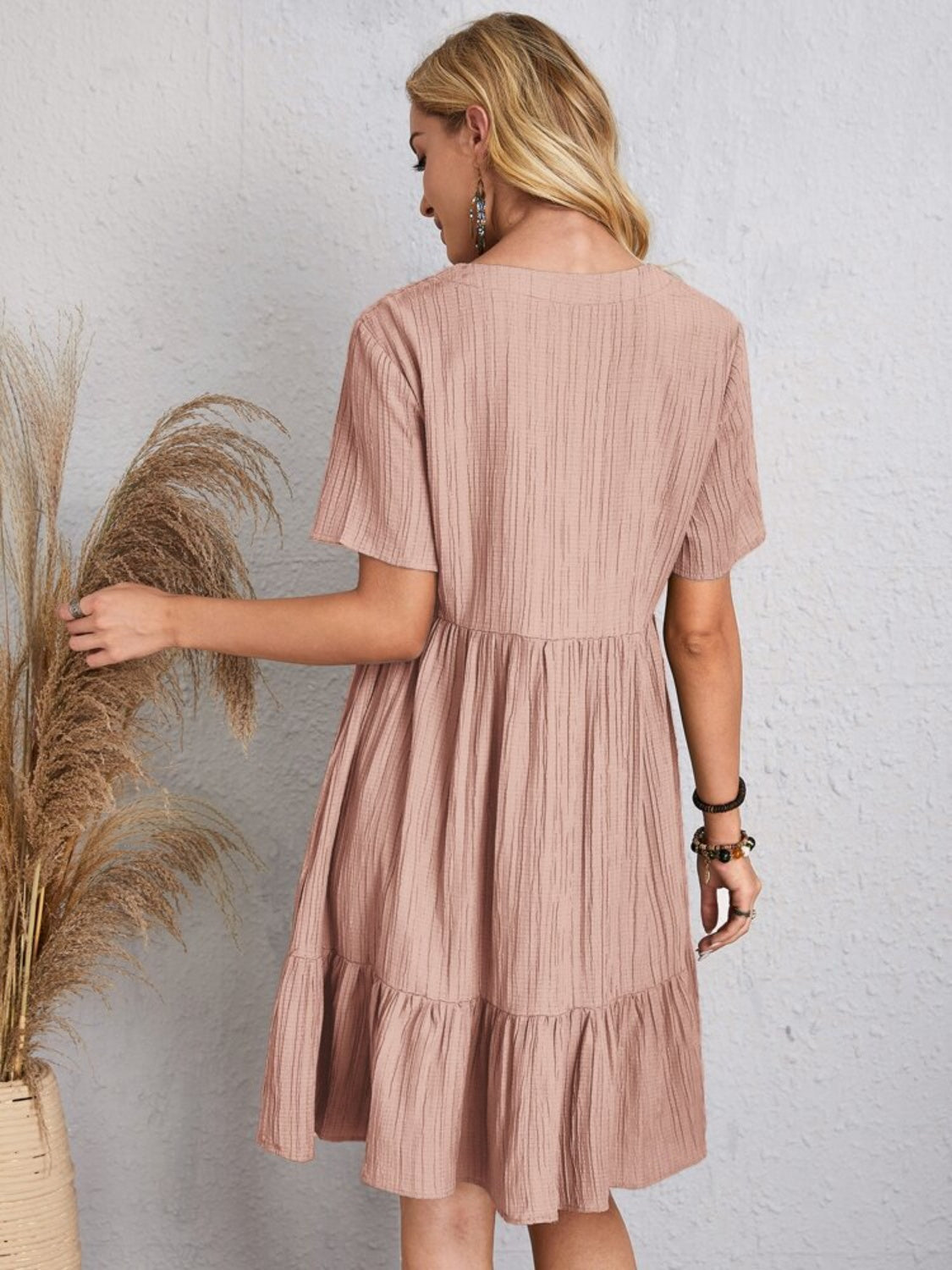 Comfortable beige dress featuring soft, textured fabric

