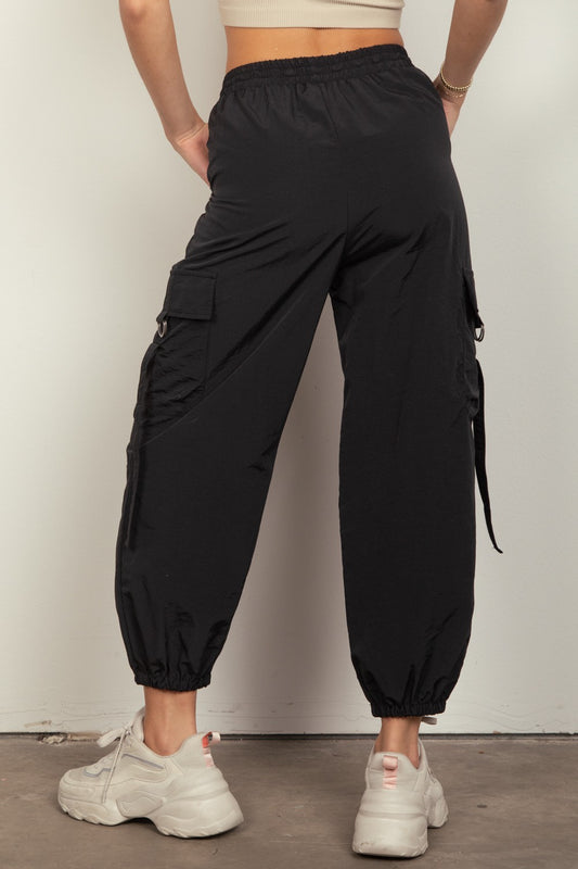 Trendy black cargo joggers with multiple pockets for women.