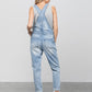 Casual destroyed light wash overalls with ripped details and side button closures.
