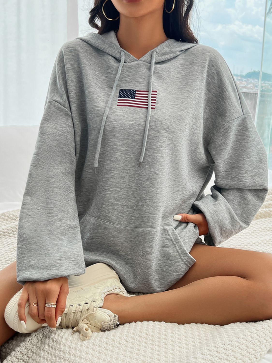 Cozy American flag hoodie with a comfortable, oversized fit.
