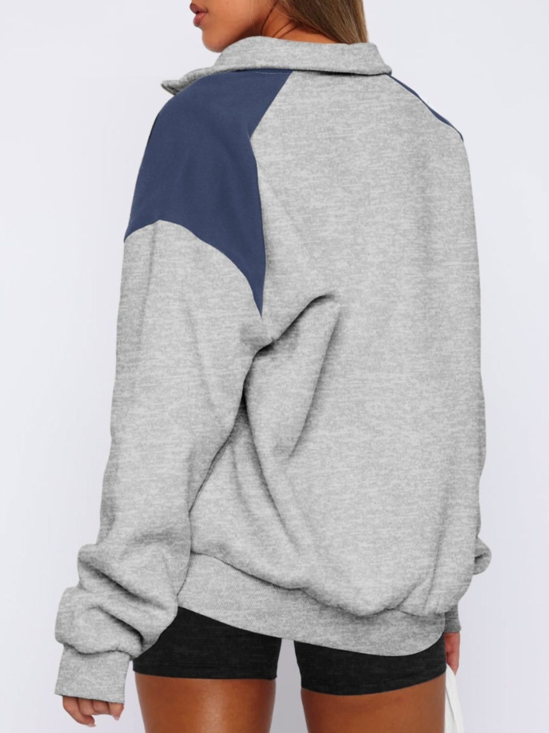 Women's gray half-zip color block sweatshirt, casual and comfy.
