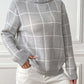 Gray plaid turtleneck sweater styled for a cozy fall look