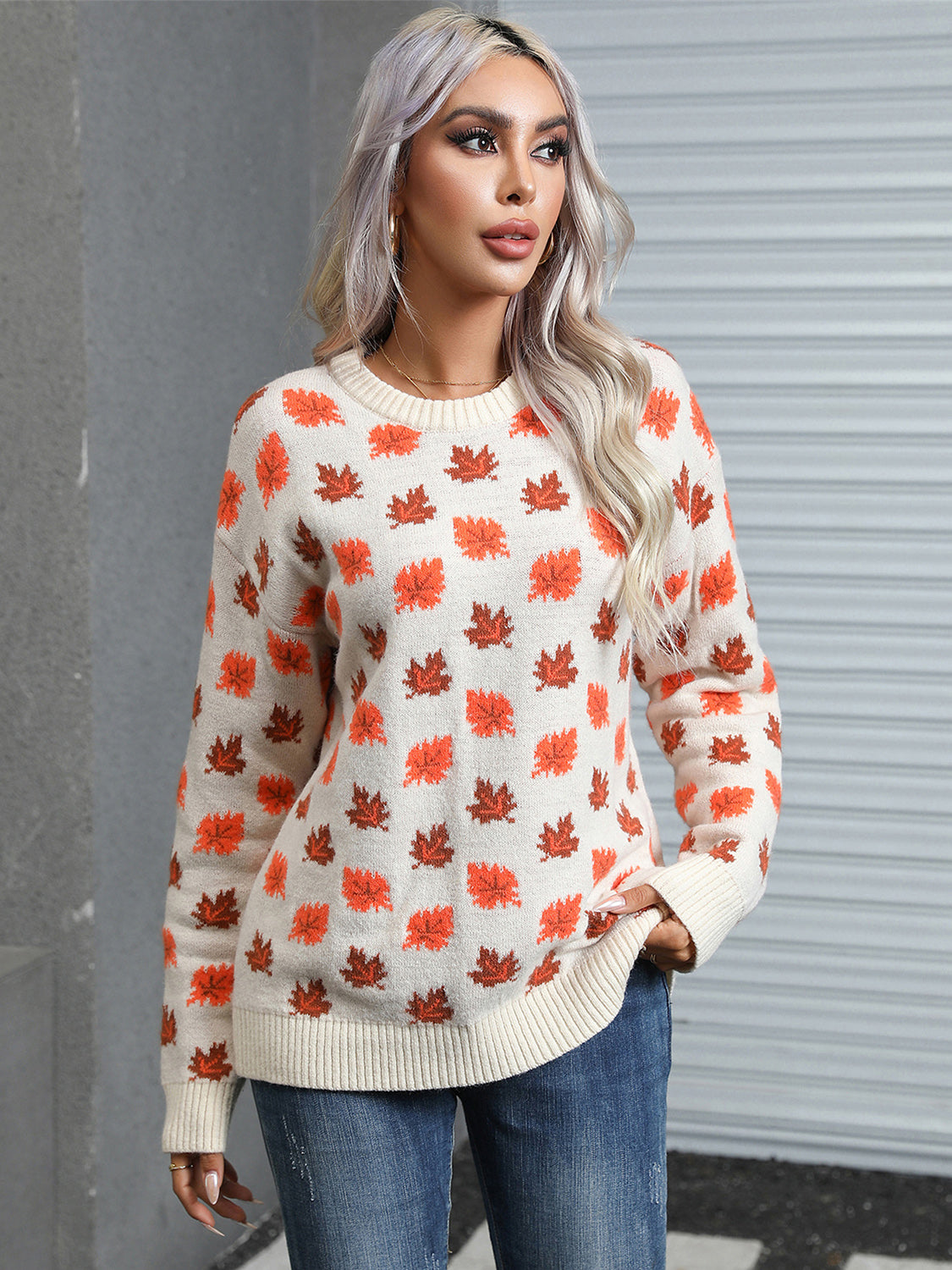 Casual ivory sweater with an autumn leaf design, ideal for staying cozy during the fall season.