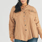 Casual collared shirt for plus-size women with a unique distressed hem.
