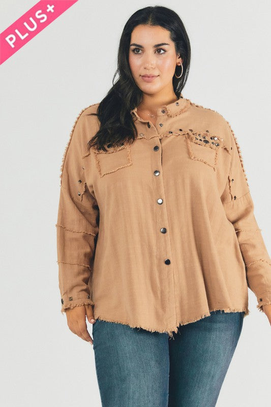 Casual collared shirt for plus-size women with a unique distressed hem.
